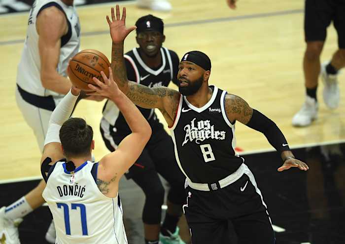 Jun 2, 2021; Los Angeles, California, USA; Los Angeles Clippers forward Marcus Morris Sr. (8) defends Dallas Mavericks guard Luka Doncic (77) as he looks to pass the ball in the first half of game five in the first round of the 2021 NBA Playoffs. at Staples Center. Mandatory Credit: Jayne Kamin-Oncea-USA TODAY Sports